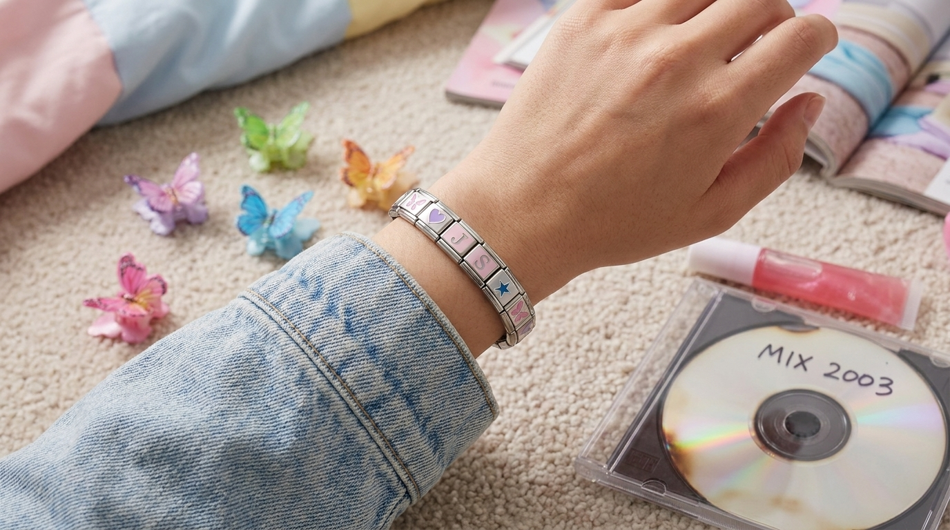Y2K-era Italian charm bracelets stacked on a wrist, the 2000s trend revived for 2026